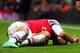 LONDON, ENGLAND - JANUARY 04: (EDITORS NOTE: Retransmission of image #460558025 with an alternate crop) Theo Walcott of Arsenal lies injured on the pitch during the Budweiser FA Cup third round match between Arsenal and Tottenham Hotspur at Emirates Sta