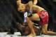Nov 6, 2013; Fort Campbell, KY, USA; Yves Edwards (red gloves) fights Yancy Medeiros (blue gloves) in the lightweight bout during UFC Fight for the Troops at Fort Campbell. Mandatory Credit: Joshua Lindsey-USA TODAY Sports