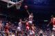AUBURN HILLS, MI - 1990: Isiah Thomas #11 of the Detroit Pistons shoots a layup against Dominique Wilkins #21 of the Atlanta Hawks during a game in 1990 at the Palace of Auburn Hills in Auburn Hills, Michigan. NOTE TO USER: User expressly acknowledges t