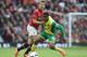 MANCHESTER, ENGLAND - APRIL 26: Michael Carrick of Manchester United battles with Leroy Fer of Norwich City during the Barclays Premier League match between Manchester United and Norwich City at Old Trafford on April 26, 2014 in Manchester, England. (Ph