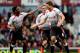 LONDON, ENGLAND - APRIL 06: Steven Gerrard (C)of Liverpool celebrates with teammate Raheem Sterling (L) after scoring the opening goal from the penalty spot during the Barclays Premier League match between West Ham United and Liverpool at Boleyn Ground o