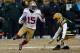 GREEN BAY, WI - JANUARY 05: Michael Crabtree #15 of the San Francisco 49ers runs with the ball after a catch against Morgan Burnett #42 of the Green Bay Packers during their NFC Wild Card Playoff game at Lambeau Field on January 5, 2014 in Green Bay, Wis