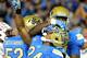 PASADENA, CA - NOVEMBER 23: Paul Perkins #24 of the UCLA Bruins celebrates his touchdown with Caleb Benenoch #74 to trail 35-27 to the Arizona State Sun Devils at Rose Bowl on November 23, 2013 in Pasadena, California. (Photo by Harry How/Getty Images)
