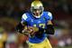 LOS ANGELES, CA - NOVEMBER 30: Quarterback Brett Hundley #17 of the UCLA Bruins carries on a 12 yard touchdown run in the third quarter against the USC Trojans at Los Angeles Coliseum on November 30, 2013 in Los Angeles, California. The Bruins won 35-14