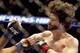 Jan 15, 2014; Duluth, GA, USA; Beneil Dariush (blue gloves) fights Charlie Brenneman (red gloves) during UFC Fight Night at Gwinnett Center. Dariush won. Mandatory Credit: Joshua S. Kelly-USA TODAY Sports