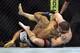 Apr 26, 2014; Baltimore, MD, USA; Jim Miller (red gloves) fights Yancy Medeiros (blue gloves) during their fight in UFC 172 at Baltimore Arena. Mandatory Credit: Tommy Gilligan-USA TODAY Sports
