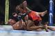 Apr 26, 2014; Baltimore, MD, USA; Jon Jones (top) punches Glover Teixeira during the UFC light heavy weight championship fight at Baltimore Arena. Jones retained the light heavy height championship by defeating Teixeria. Mandatory Credit: Tommy Gillig