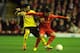 LIVERPOOL, ENGLAND - NOVEMBER 22: Gonzalo Zarate of Young Boys competes with Suso of Liverpool during the UEFA Europa League Group A match between Liverpool FC and BSC Young Boys at Anfield on November 22, 2012 in Liverpool, England. (Photo by Chris Brun