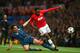 MANCHESTER, ENGLAND - APRIL 01: Javi Martinez of Bayern Muenchen tackles Danny Welbeck of Manchester United during the UEFA Champions League Quarter Final first leg match between Manchester United and FC Bayern Muenchen at Old Trafford on April 1, 2014 i