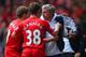 LIVERPOOL, ENGLAND - APRIL 27: Steven Gerrard and Jon Flanagan of Liverpool have words with Jose Mourinho manager of Chelsea during the Barclays Premier League match between Liverpool and Chelsea at Anfield on April 27, 2014 in Liverpool, England. (Phot