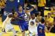 Apr 27, 2014; Oakland, CA, USA; Los Angeles Clippers guard J.J. Redick (4) looks to pass the ball to forward Blake Griffin (32) against Golden State Warriors forward Andre Iguodala (9) and forward Draymond Green (23) during the first quarter of game four