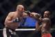 Apr 26, 2014; Baltimore, MD, USA; Jon Jones and Glover Teixeira exchange punches during the UFC light heavy weight championship fight at Baltimore Arena. Jones retained the light heavy height championship by defeating Teixeria. Mandatory Credit: Tommy