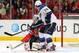 Apr 27, 2014; Chicago, IL, USA; Chicago Blackhawks goalie Corey Crawford (50) makes a save on a tip attempt by St. Louis Blues right wing T.J. Oshie (74) during the second period in game six of the first round of the 2014 Stanley Cup Playoffs at the Unite