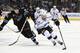 SAN JOSE, CA - APRIL 26: Jarret Stoll #28 of the Los Angeles King skates with control of the puck keeping it away from Justin Braun #61 of the San Jose Sharks in the third period in Game Five of the First Round of the 2014 NHL Stanley Cup Playoffs at SAP