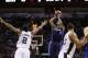 Jan 8, 2014; San Antonio, TX, USA; Dallas Mavericks guard Monta Ellis (11) shoots against San Antonio Spurs forward Kawhi Leonard (2) during the second half at AT&T Center. The Spurs won 112-90. Mandatory Credit: Soobum Im-USA TODAY Sports