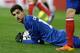 The photographer had to crop this shot of Atletico Madrid goalkeeper Thibaut Courtois this way or else it would have taken three computer monitors to see and the young Belgian's feet would still be touching the wall to your right. He's tall.