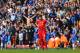LIVERPOOL, ENGLAND - APRIL 27: (EDITORS NOTE: Retransmission of image 487064815 with alternate crop.) A dejected Steven Gerrard of Liverpool looks on as the Chelsea fans celebrate after Willian of Chelsea scored their second goal during the Barclays Premi