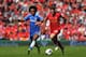 LIVERPOOL, ENGLAND - APRIL 27: Willian of Chelsea and Joe Allen of Liverpool compete for the ball during the Barclays Premier League match between Liverpool and Chelsea at Anfield on April 27, 2014 in Liverpool, England. (Photo by Clive Brunskill/Getty