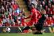 LIVERPOOL, ENGLAND - OCTOBER 05: Daniel Sturridge of Liverpool shoots past Stuart O'Keefe of Crystal Palace during the Barclays Premier League match between Liverpool and Crystal Palace at Anfield on October 5, 2013 in Liverpool, England. (Photo by Cliv