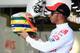SAO PAULO, BRAZIL - NOVEMBER 25: Lewis Hamilton of Great Britain and McLaren shows his specially designed drivers helmet featuring a tribute to the late Ayrton Senna during practice for the Brazilian Formula One Grand Prix at the Autodromo Jose Carlos Pa