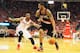 HOUSTON, TX - APRIL 23: LaMarcus Aldridge #12 of the Portland Trail Blazers drives with the ball against Terrence Jones #6 of the Houston Rockets during the second half in Game Two of the Western Conference Quarterfinals during the 2014 NBA Playoffs at