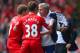 LIVERPOOL, ENGLAND - APRIL 27: (EDITORS NOTE: Retransmission of image 487057275 with alternate crop.) Steven Gerrard and Jon Flanagan of Liverpool have words with Jose Mourinho manager of Chelsea as he holds onto the ball during the Barclays Premier Leagu