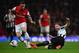 LONDON, ENGLAND - APRIL 28: Paul Dummett of Newcastle United tackles Mesut Oezil of Arsenal during the Barclays Premier League match between Arsenal and Newcastle United at Emirates Stadium on April 28, 2014 in London, England. (Photo by Jamie McDonald/