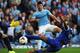 MANCHESTER, ENGLAND - OCTOBER 05: Sergio Aguero of Manchester City shoots past Sylvain Distin (R) and Tim Howard (L) of Everton to score his team's second goal during the Barclays Premier League match between Manchester City and Everton at Etihad Stadium