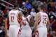Jan 16, 2014; Houston, TX, USA; Houston Rockets shooting guard James Harden (13) speaks with power forward Dwight Howard (12) and small forward Chandler Parsons (25) during the first quarter against the Oklahoma City Thunder at Toyota Center. Mandatory Cr