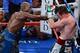 LAS VEGAS, NV - SEPTEMBER 14: (L-R) Floyd Mayweather Jr. throws a right at Canelo Alvarez during their WBC/WBA 154-pound title fight at the MGM Grand Garden Arena on September 14, 2013 in Las Vegas, Nevada. (Photo by Ethan Miller/Getty Images)