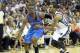 Apr 26, 2014; Memphis, TN, USA; Oklahoma City Thunder guard Reggie Jackson (15) drives against Memphis Grizzlies guard Mike Conley (11) during game four of the first round of the 2014 NBA Playoffs at FedExForum. Thunder defeated the Grizzlies 92-89. Manda