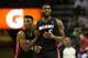 CHARLOTTE, NC - APRIL 28: LeBron James #6 and teammate Norris Cole #30 of the Miami Heat reacts after a play on their way to defeating the Charlotte Bobcats 109-98 in Game Four of the Eastern Conference Quarterfinals during the 2014 NBA Playoffs at Time
