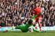 LONDON, ENGLAND - MARCH 23: Adam Lallana of Southampton scores his team's second goal past Hugo Lloris of Tottenham Hotspur during the Barclays Premier League match between Tottenham Hotspur and Southampton at White Hart Lane on March 23, 2014 in London,