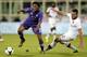 FLORENCE, ITALY - APRIL 19: Guillermo Cuadrado of ACF Fiorentina fights for the ball with Rafael Toloi of AS Roma during the Serie A match between ACF Fiorentina and AS Roma at Stadio Artemio Franchi on April 19, 2014 in Florence, Italy. (Photo by Gabrie