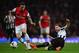 LONDON, ENGLAND - APRIL 28: Paul Dummett of Newcastle United tackles Mesut Oezil of Arsenal during the Barclays Premier League match between Arsenal and Newcastle United at Emirates Stadium on April 28, 2014 in London, England. (Photo by Jamie McDonald/