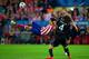 MADRID, SPAIN - APRIL 22: Diego Costa of Club Atletico de Madrid kicks the ball under pressure from David Luiz of Chelsea during the UEFA Champions League Semi Final first leg match between Club Atletico de Madrid and Chelsea at Vicente Calderon Stadium