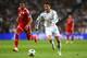 MADRID, SPAIN - APRIL 23: Cristiano Ronaldo of Real Madrid takes on Jerome Boateng of Bayern Muenchen during the UEFA Champions League semi-final first leg match between Real Madrid and FC Bayern Muenchen at the Estadio Santiago Bernabeu on April 23, 2014