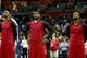 CHARLOTTE, NC - APRIL 28: Chris Bosh #1 of the Miami Heat stands alongside teammates LeBron James #6 and Dwyane Wade #3 while wearing inside out warm up jerseys before playing the Charlotte Bobcats in Game Four of the Eastern Conference Quarterfinals dur