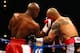 LAS VEGAS, NV - MAY 05: (L-R) Floyd Mayweather Jr. throws a right to the face of Miguel Cotto during their WBA super welterweight title fight at the MGM Grand Garden Arena on May 5, 2012 in Las Vegas, Nevada. (Photo by Al Bello/Getty Images)