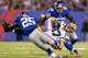EAST RUTHERFORD, NJ - NOVEMBER 17: Jordy Nelson #87 of the Green Bay Packers collides with Will Hill #25 of the New York Giants as Jon Beason #52 of the Giants stands by in the second half at MetLife Stadium on November 17, 2013 in East Rutherford, New