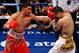 LAS VEGAS - DECEMBER 11: (L-R) Amir Khan of England throws a left to the face of Marcos Maidana of Argentina during the WBA super lightweight title fight at Mandalay Bay Events Center on December 11, 2010 in Las Vegas, Nevada. (Photo by Ethan Miller/Get