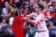 Apr 29, 2014; Chicago, IL, USA; Chicago Bulls guard Kirk Hinrich (12) fouls Washington Wizards guard John Wall (2) during the second half in game five of the first round of the 2014 NBA Playoffs at United Center. The Wizards won 75-69 and won the series 4
