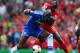 LIVERPOOL, ENGLAND - APRIL 27: Demba Ba of Chelsea and Mamadou Sakho of Liverpool battle for the ball during the Barclays Premier League match between Liverpool and Chelsea at Anfield on April 27, 2014 in Liverpool, England. (Photo by Clive Brunskill/G