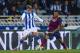 SAN SEBASTIAN, SPAIN - FEBRUARY 12: Dani Alves of FC Barcelona duels for the ball with Antoine Griezmann of Real Sociedad during the Copa del Rey Semi-Final first leg match between Real Sociedad and Barcelona at Estadio Anoeta on February 12, 2014 in Sa