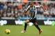 NEWCASTLE UPON TYNE, ENGLAND - FEBRUARY 23: Loic Remy of Newcastle United runs with the ball during the Barclays Premier League match between Newcastle United and Aston Villa at St James' Park on February 23, 2014 in Newcastle upon Tyne, England. (Photo