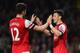 LONDON, ENGLAND - APRIL 28: Mesut Oezil of Arsenal (11) celebrates with Olivier Giroud as he scores their second goal during the Barclays Premier League match between Arsenal and Newcastle United at Emirates Stadium on April 28, 2014 in London, England.