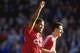 3 Feb 1990: John Barnes of Liverpool and teammate Ian Rush acknowledge the crowd after a goal in the derby match against Everton at Anfield in Liverpool. Mandatory Credit: Ben Radford/Allsport