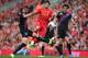 LIVERPOOL, ENGLAND - OCTOBER 05: Luis Suarez of Liverpool in action with Damien Delaney and Mile Jedinak of Crystal Palace during the Barclays Premier League match between Liverpool and Crystal Palace at Anfield on October 5, 2013 in Liverpool, England.