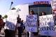 Apr 29, 2014; Los Angeles, CA, USA; Demonstrators hold up signs in front of Staples Center demanding the sale of the Los Angeles Clippers prior to game five of the first round of the 2014 NBA Playoffs. The NBA handed down a lifetime ban on Clippers owner