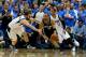 DALLAS, TX - APRIL 28: Tony Parker #9 of the San Antonio Spurs dribbles the ball against Jose Calderon #8 of the Dallas Mavericks in Game Four of the Western Conference Quarterfinals during the 2014 NBA Playoffs at American Airlines Center on April 28, 2